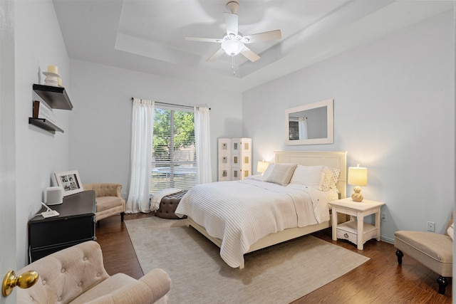 221 Whitestone Way, Weatherford, TX 76085 - bedroom with a raised ceiling, wood finished floors, and a ceiling fan
