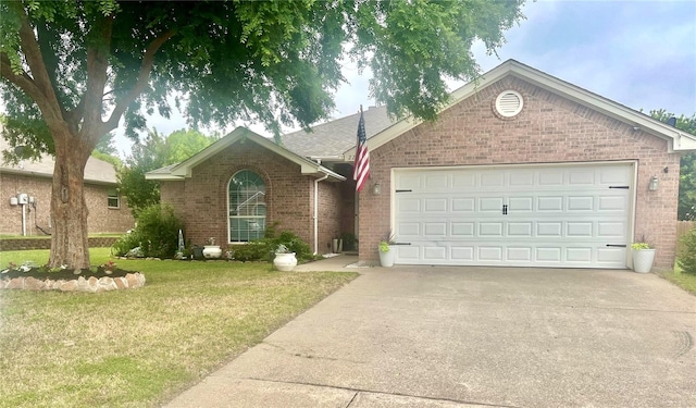 221 Whitestone Way, Weatherford, TX 76085 - ranch-style house with brick siding, concrete driveway, an attached garage, and a front lawn