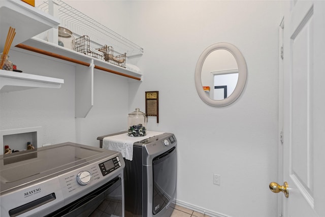 221 Whitestone Way, Weatherford, TX 76085 - laundry room with washing machine and clothes dryer and light tile patterned floors