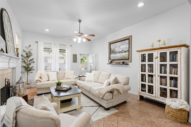 221 Whitestone Way, Weatherford, TX 76085 - living room featuring ceiling fan, tile patterned floors, a tiled fireplace, recessed lighting, and baseboards
