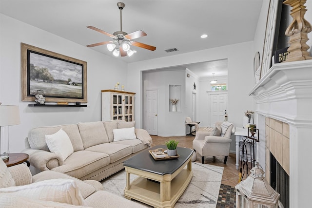221 Whitestone Way, Weatherford, TX 76085 - tiled living room with a tiled fireplace, ceiling fan, and recessed lighting