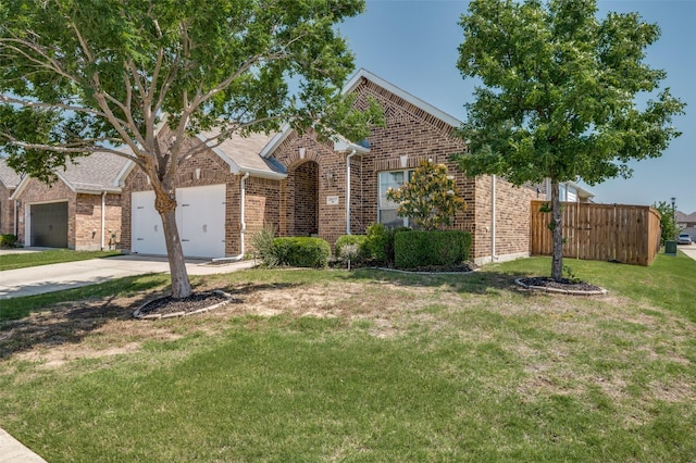 2617 Castle Creek Dr, Little Elm, TX 75068 - view of front facade with driveway, a garage, and brick siding