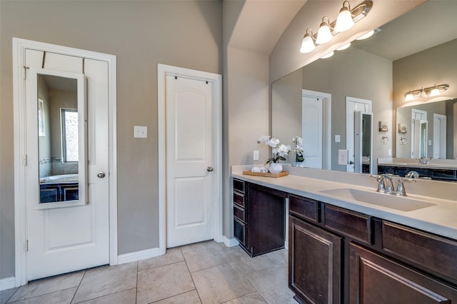 2617 Castle Creek Dr, Little Elm, TX 75068 - full bathroom featuring double vanity, tile patterned flooring, and baseboards