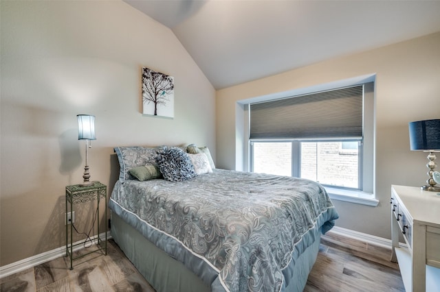 2617 Castle Creek Dr, Little Elm, TX 75068 - bedroom featuring vaulted ceiling, baseboards, and wood finished floors