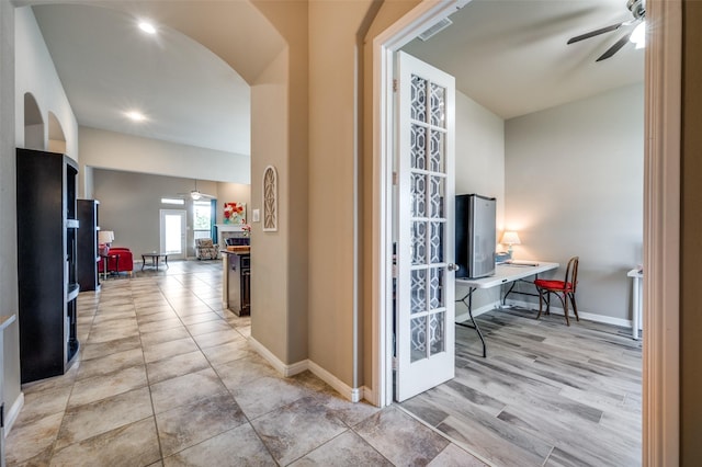 2617 Castle Creek Dr, Little Elm, TX 75068 - hall featuring arched walkways, a desk, and baseboards