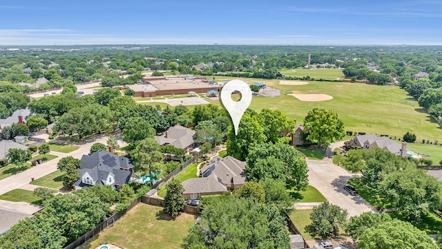 aerial perspective of suburban area featuring a tree filled landscape