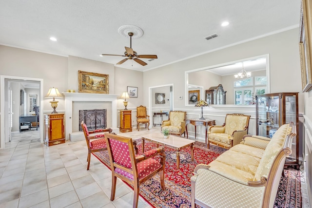 living area with a fireplace with raised hearth, crown molding, a chandelier, a ceiling fan, and recessed lighting