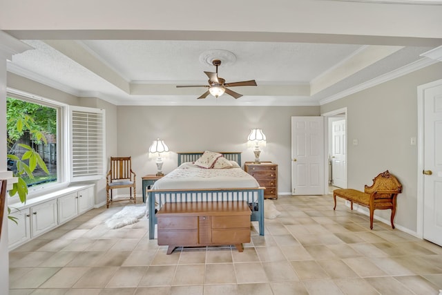 bedroom featuring crown molding, a tray ceiling, light tile patterned floors, and baseboards