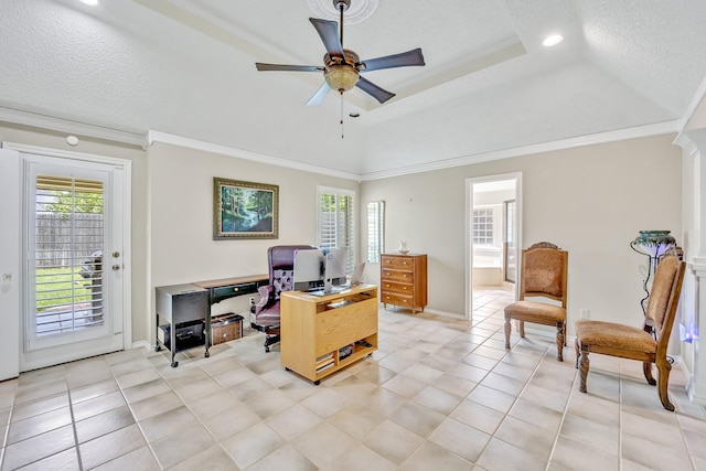 home office with a ceiling fan, plenty of natural light, light tile patterned floors, crown molding, and a textured ceiling