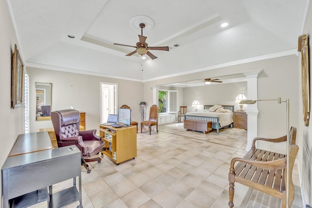 bedroom featuring a raised ceiling, ornate columns, crown molding, and ceiling fan