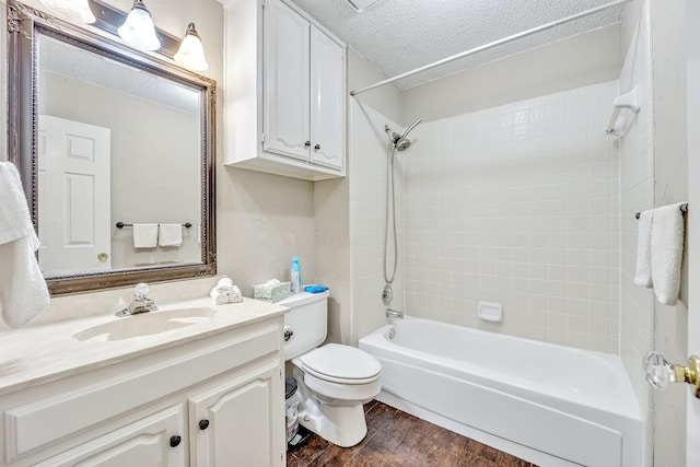 5403 Linden Ct, Colleyville, TX 76034 - full bathroom featuring vanity, wood finished floors, washtub / shower combination, and a textured ceiling
