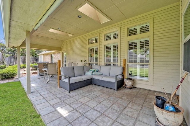 view of patio featuring an outdoor hangout area and fence