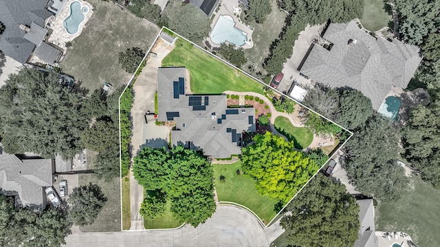aerial perspective of suburban area with a pool area and property boundaries highlighted
