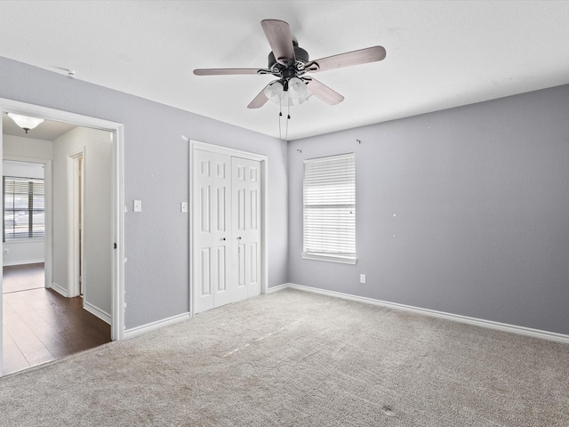 402 Brookview Dr, Decatur, TX 76234 - unfurnished bedroom featuring carpet floors, multiple windows, a closet, and baseboards