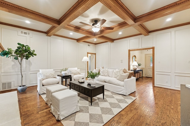 1141 Yorkshire Dr, Carrollton, TX 75007 - living area with a decorative wall, beamed ceiling, wood finished floors, ceiling fan, and crown molding