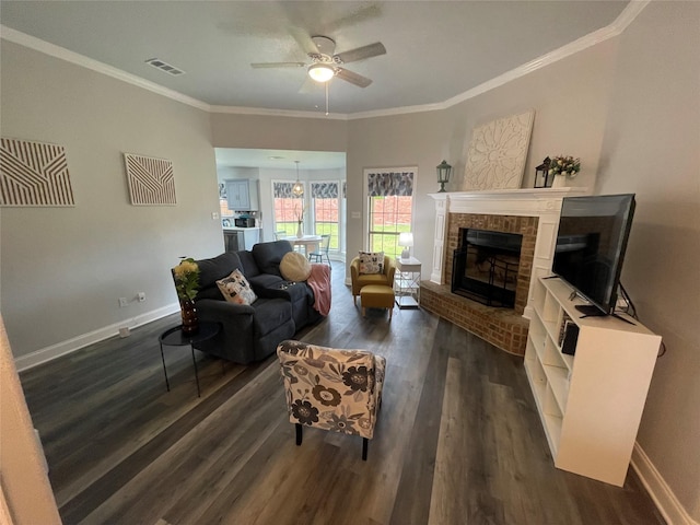 2004 Willowcrest, Kaufman, TX 75142 - living room featuring dark wood-type flooring, ceiling fan, ornamental molding, baseboards, and a brick fireplace