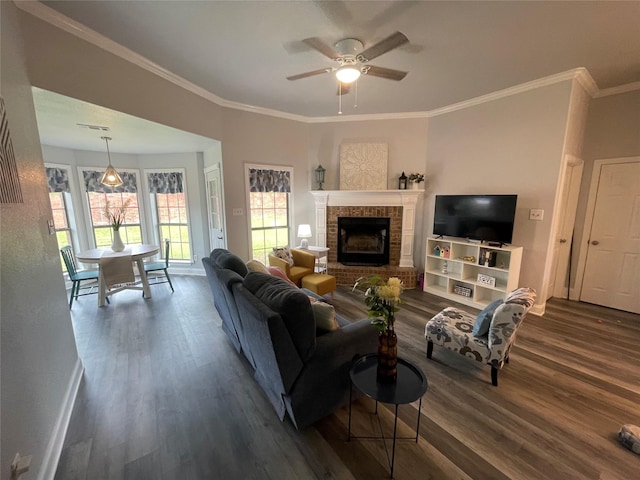 2004 Willowcrest, Kaufman, TX 75142 - living room with dark wood-type flooring, a ceiling fan, crown molding, baseboards, and a brick fireplace