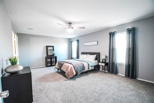 1433 Sun Breeze Dr, Little Elm, TX 75068 - carpeted bedroom with ceiling fan and baseboards