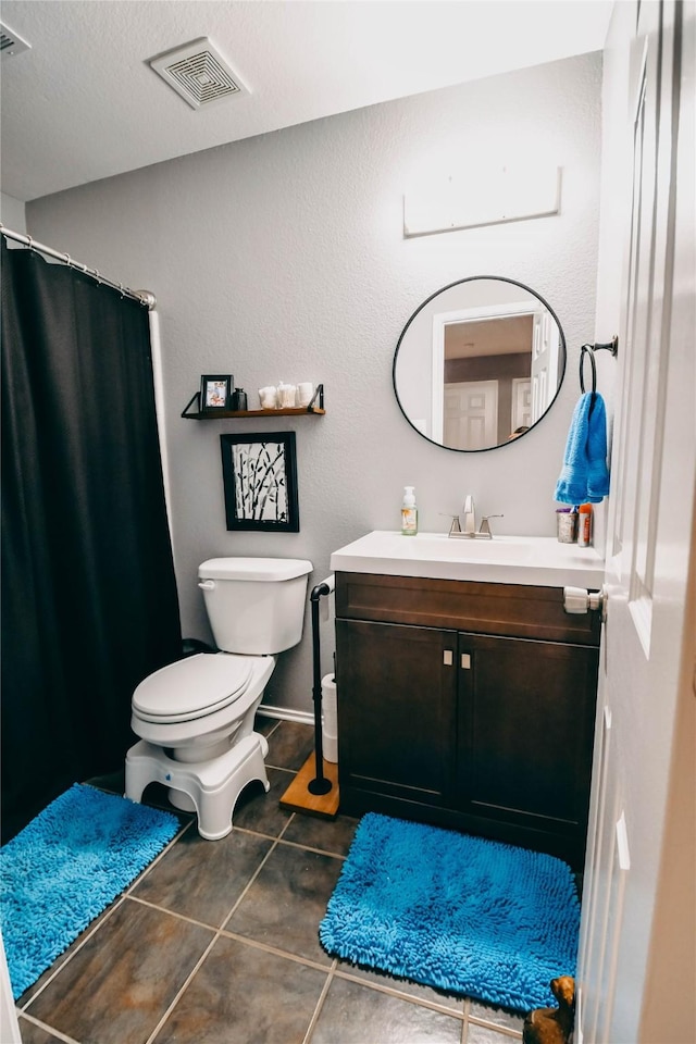 1433 Sun Breeze Dr, Little Elm, TX 75068 - bathroom featuring vanity, toilet, and a shower with curtain