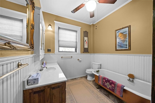 403 S Royall, Palestine, TX 75801 - full bathroom with wainscoting, ornamental molding, a freestanding bath, vanity, and a ceiling fan