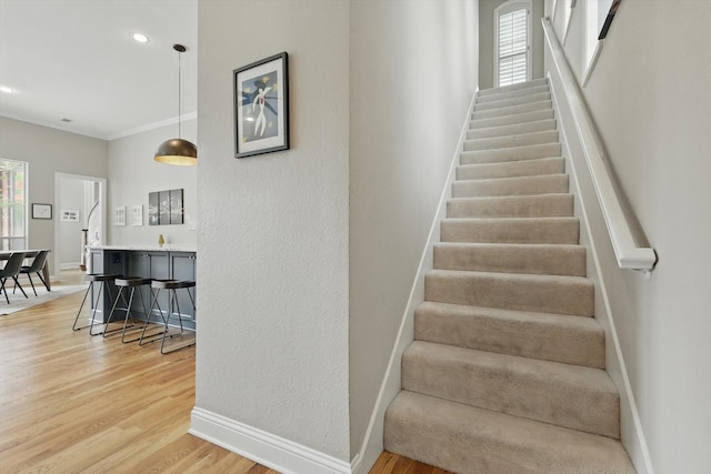 5741 Misted Breeze Dr, Plano, TX 75093 - staircase with wood finished floors, baseboards, and ornamental molding
