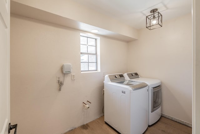 707 Kyle Dr, Arlington, TX 76011 - washroom with washer and clothes dryer and light wood-style floors