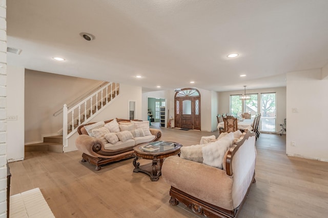 707 Kyle Dr, Arlington, TX 76011 - living room with stairs, light wood-style floors, and recessed lighting