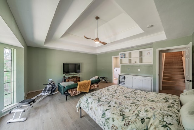 707 Kyle Dr, Arlington, TX 76011 - bedroom with a tray ceiling, light wood-style flooring, ceiling fan, and baseboards