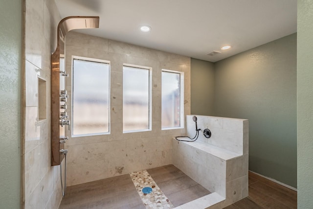 707 Kyle Dr, Arlington, TX 76011 - bathroom featuring a walk in shower and wood finished floors