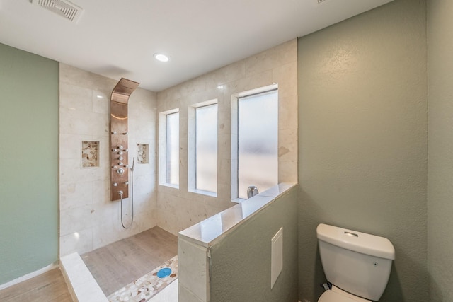 707 Kyle Dr, Arlington, TX 76011 - bathroom with toilet, wood finished floors, and walk in shower