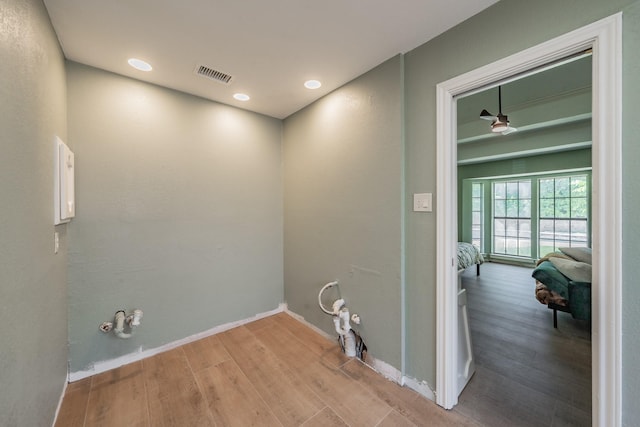 707 Kyle Dr, Arlington, TX 76011 - laundry area featuring wood finished floors, baseboards, and recessed lighting