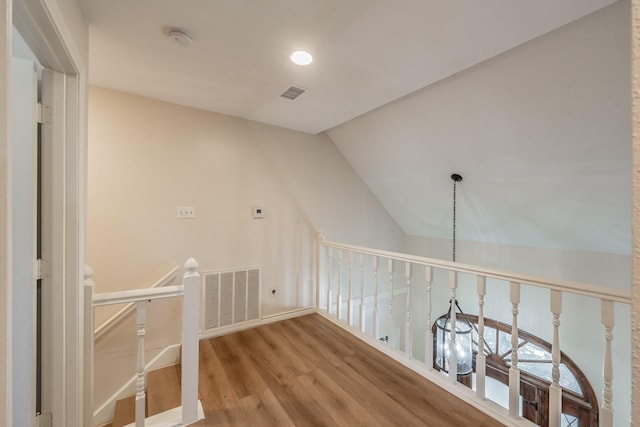 707 Kyle Dr, Arlington, TX 76011 - hall with wood finished floors, vaulted ceiling, an upstairs landing, and recessed lighting