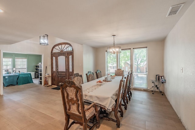 707 Kyle Dr, Arlington, TX 76011 - dining space with a chandelier and light wood-style floors