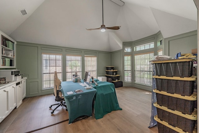 707 Kyle Dr, Arlington, TX 76011 - office area featuring a decorative wall, a ceiling fan, light wood finished floors, and high vaulted ceiling