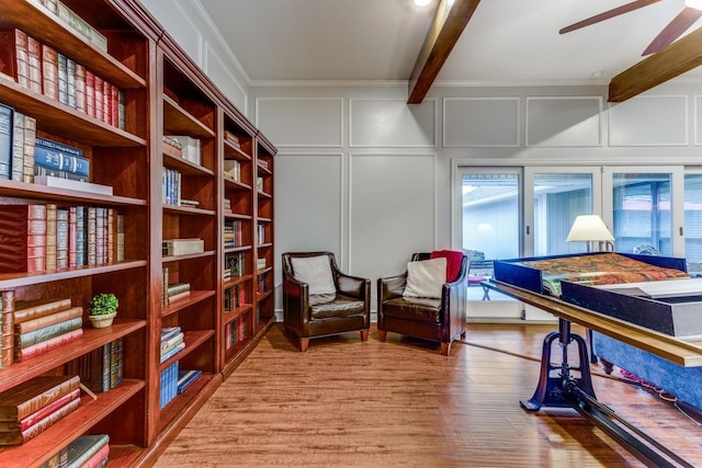 10014 Silver Creek Rd, Dallas, TX 75243 - living area featuring a decorative wall, beamed ceiling, ceiling fan, wood finished floors, and ornamental molding