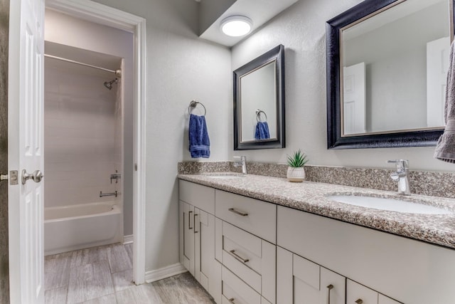 10014 Silver Creek Rd, Dallas, TX 75243 - full bath with double vanity, baseboards, and bathtub / shower combination