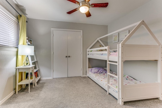 10014 Silver Creek Rd, Dallas, TX 75243 - carpeted bedroom with a ceiling fan, baseboards, and a closet