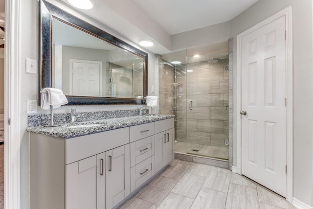 10014 Silver Creek Rd, Dallas, TX 75243 - bathroom featuring a shower stall and double vanity