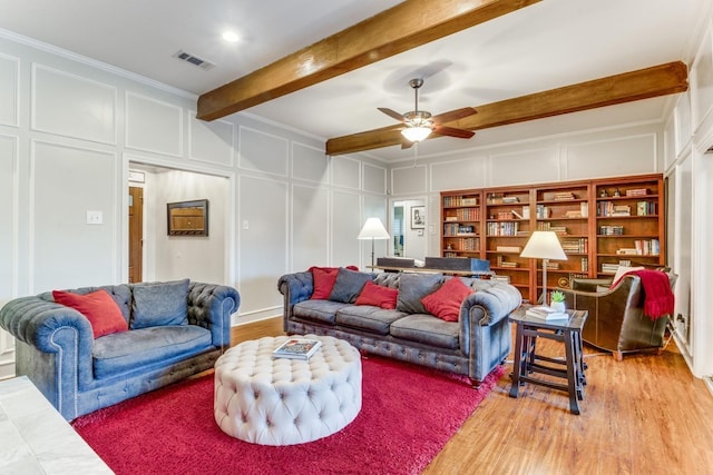 10014 Silver Creek Rd, Dallas, TX 75243 - living area with a decorative wall, ceiling fan, beam ceiling, light wood-style floors, and ornamental molding