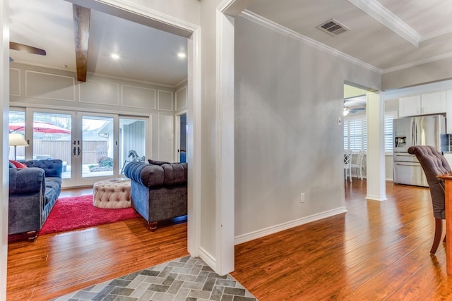 10014 Silver Creek Rd, Dallas, TX 75243 - living room with crown molding, french doors, wood finished floors, baseboards, and a ceiling fan