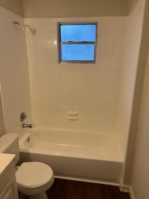 437 Browning Dr, Arlington, TX 76010 - bathroom featuring vanity, toilet, bathtub / shower combination, and wood finished floors