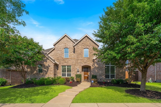 8803 Kelvington Dr, Frisco, TX 75035 - traditional-style home with brick siding and a front yard