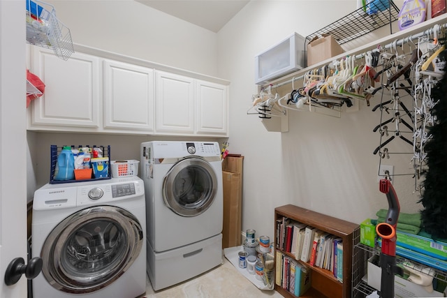 8803 Kelvington Dr, Frisco, TX 75035 - laundry area with washing machine and clothes dryer and cabinet space