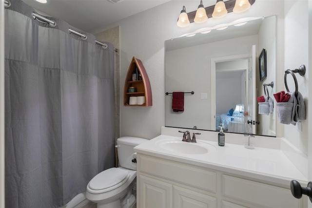 8803 Kelvington Dr, Frisco, TX 75035 - bathroom featuring vanity, toilet, and a shower with curtain