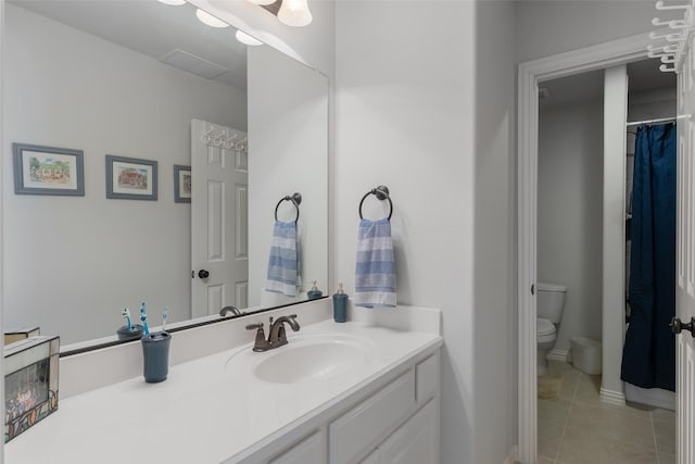 8803 Kelvington Dr, Frisco, TX 75035 - bathroom with tile patterned flooring, vanity, and toilet