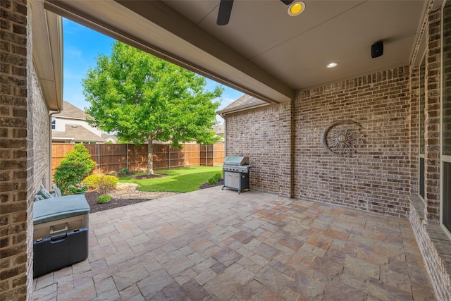 8803 Kelvington Dr, Frisco, TX 75035 - view of patio with a ceiling fan, a fenced backyard, and area for grilling