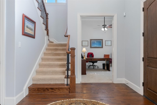 8803 Kelvington Dr, Frisco, TX 75035 - foyer entrance featuring ceiling fan, dark wood-style flooring, stairway, and baseboards