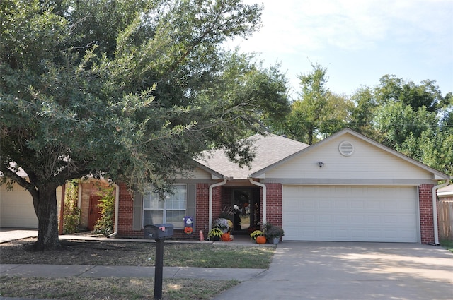 1720 Red Oak Cir, Sulphur Springs, TX 75482 - view of front of property featuring brick siding, a garage, concrete driveway, and a shingled roof