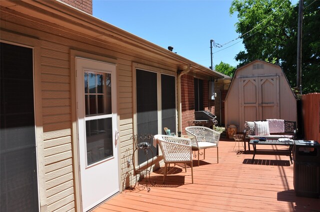 1720 Red Oak Cir, Sulphur Springs, TX 75482 - wooden deck with a shed, an outdoor structure, and grilling area