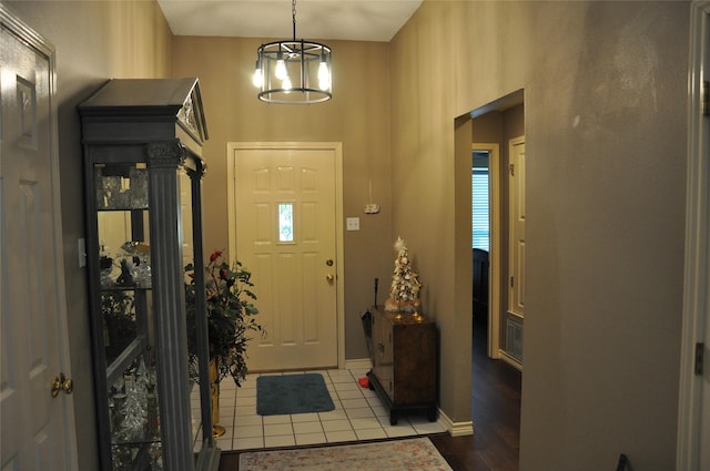 1720 Red Oak Cir, Sulphur Springs, TX 75482 - entryway featuring a towering ceiling, dark tile patterned flooring, and baseboards